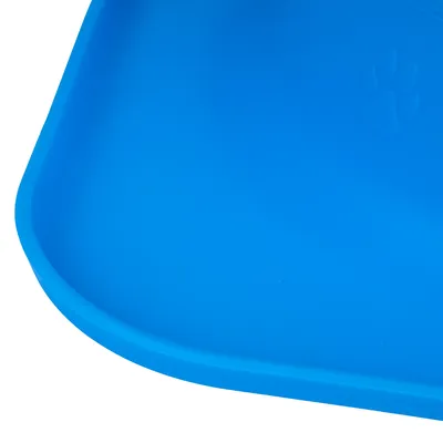 Blue plastic mat with embossed paw print in the corner.