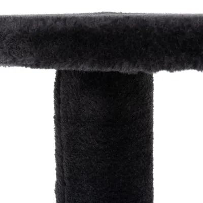 Close-up view of black, soft plush material on a vertical and horizontal surface.