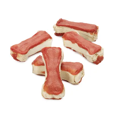 Five bone-shaped treats with a red top layer and beige base, arranged on a white background. Shows product shape and appearance for purchase decisions.