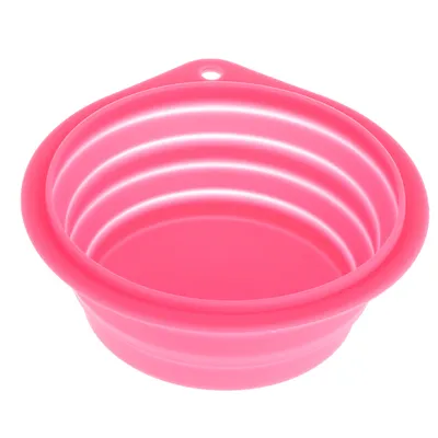 Gamelle ronde pliante en silicone rose, rebords striés, trou d’attache visible sur le bord. Aucun texte ou marque apparente.