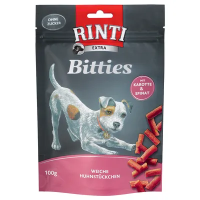 Sachet Rinti Extra Bitties, 100g, morceaux tendres de poulet, avec carotte et épinard, sans sucre. Texte en allemand : Weiche Huhnstückchen, Mit Karotte & Spinat, Ohne Zucker.