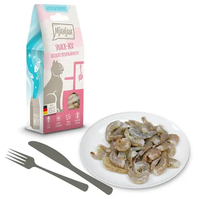 Miamjam Snack-Box Delikate Riesengarnelen, boîte avec illustration de chat et crevettes visibles, assiette de crevettes décortiquées à côté. Texte allemand sur l’emballage.