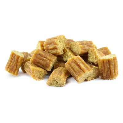 Several small, brown snack pieces with a ridged surface, suitable as a treat or reward.