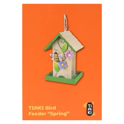 TIAKI fågelmatare 'Spring' med grönt tak, blom- och bimotiv på orange bakgrund.