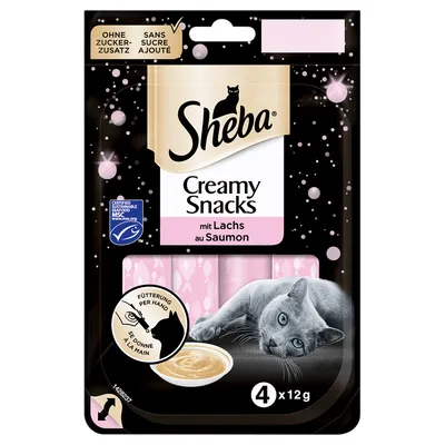 Sheba Creamy Snacks mit Lachs au Saumon, 4 x 12g. Ohne Zuckerzusatz, sans sucre ajouté. Certified sustainable seafood MSC. Image of a grey cat and creamy snack in bowl on pack.