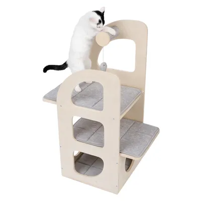 Cat furniture made of wood with three levels and grey cushions, cat playing with hanging toy on the top level.