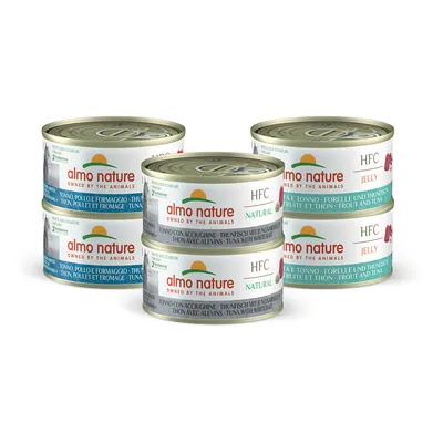 Selection of Almo Nature HFC Natural and Jelly tinned food in assorted flavours, including tuna with whitebait, trout and tuna, and tuna, chicken and cheese. Six tins shown.
