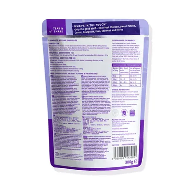 Back of wet food pouch showing ingredients, feeding guide for puppies by weight, storage instructions, and claim of no artificial colours, flavours or preservatives.