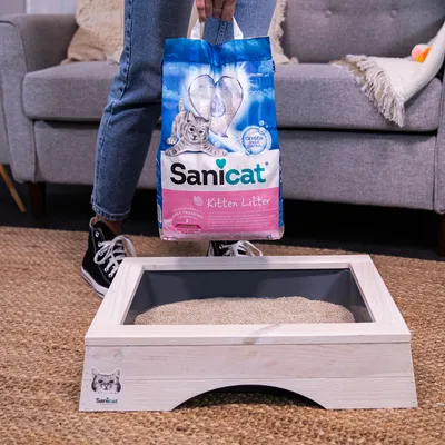 Sanicat Kitten Litter, 5L pack with Oxygen Odour Control. Suitable for easy training, shown in wooden frame litter tray.