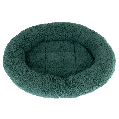 Round, green pet bed made of soft, fluffy material with raised edge and padded lying surface.