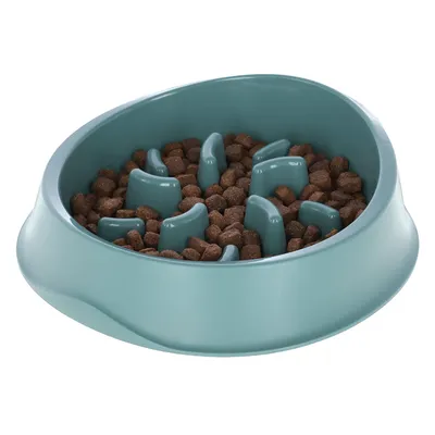 Round, turquoise anti-gulping bowl with raised obstacles, filled with brown dry food pieces.