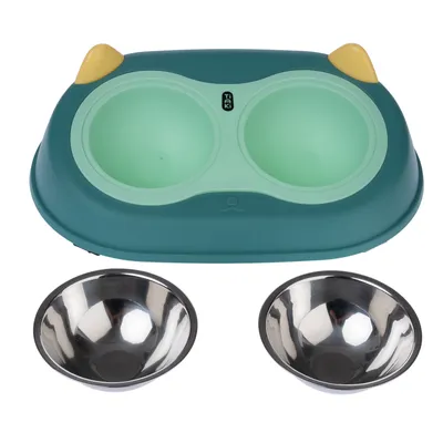 Double bowl set with green plastic holder and two removable stainless steel bowls. Yellow accents on the sides of the holder, Taki brand visible.