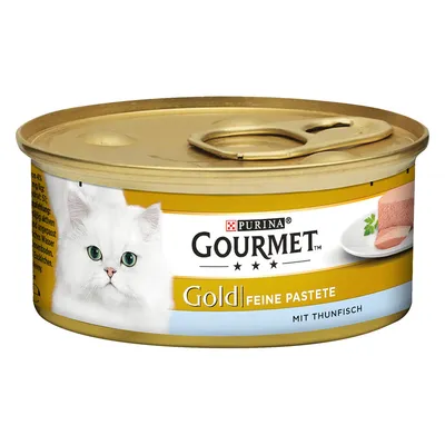 Purina Gourmet Gold нежный паштет с тунцом, банка в золотистой упаковке, изображение белой кошки и порция паштета на тарелке.