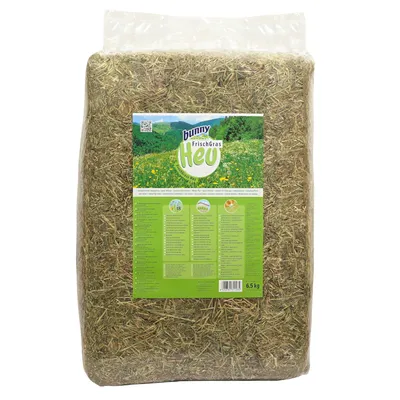 Bunny FrischGras hay, 6.5 kg. Packaging with green product description and image of a meadow with flowers. Contains information on ingredients and feeding recommendations.