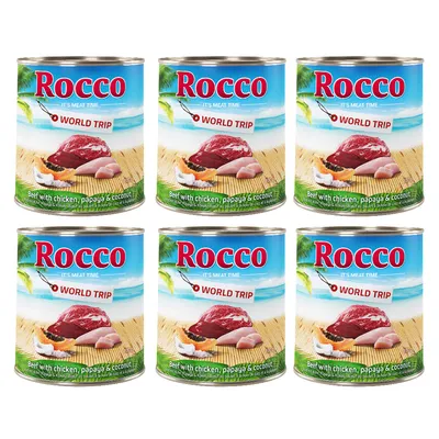 Rocco World Trip Nassfutter mit Rind, Huhn, Papaya und Kokosnuss. Sechs Dosen mit tropischem Design und Produktbeschreibung sichtbar.
