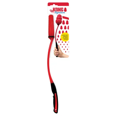 Lanceur KONG Signature, manche rouge et noir, emballage avec texte : 'Launches medium & large KONGs', main tenant le lanceur, logo KONG visible.