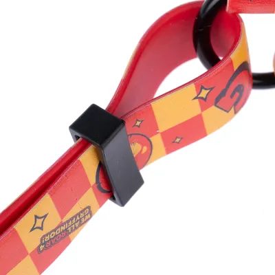 Close-up of a red and yellow collar with check pattern, stars, and the inscription 'Well Road Gryffindor'. Black plastic buckle visible.