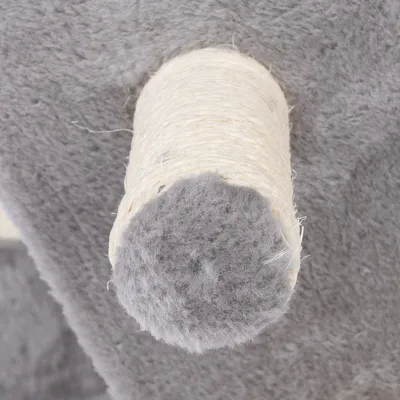 Close-up of a scratching post trunk wrapped in sisal with grey plush at the ends.