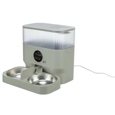 Automatic feeder with two stainless steel bowls, transparent container and control elements. Connected with power cable.