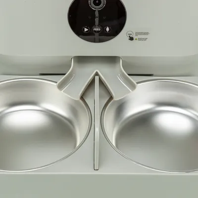 Automatic feeder with two stainless steel bowls, camera and control panel with feed and microphone buttons.