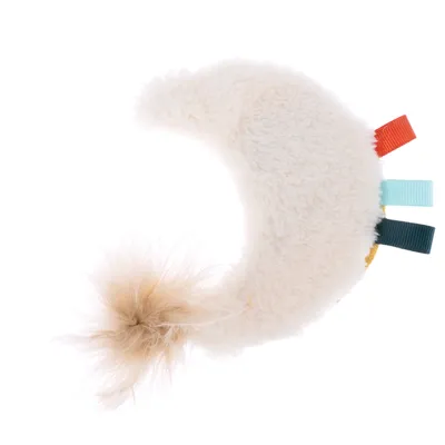 Crescent-shaped plush toy with colourful fabric ribbons and fluffy tail.