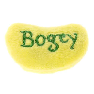 Juguete de peluche amarillo con inscripción verde 'Bogey'.