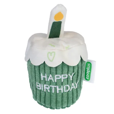 Plush toy shaped like a cupcake with a candle, featuring the words 'HAPPY BIRTHDAY' embroidered on the front.