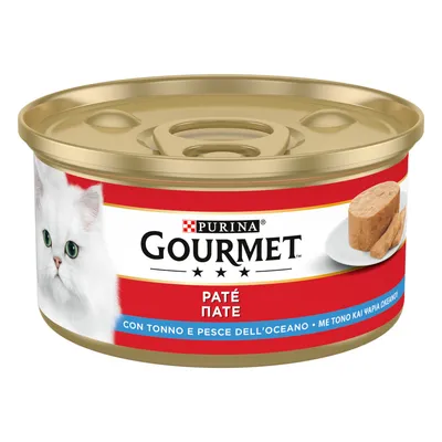 Purina Gourmet Paté con atún y pescado marino, lata con etiqueta roja y foto de un gato blanco y paté servido.