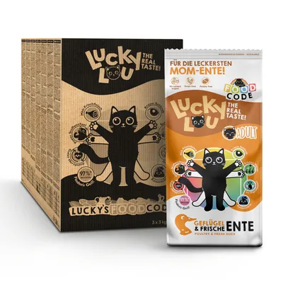 Lucky Lou The Real Taste! Adult, Geflügel & frische Ente. Texte en allemand et anglais sur l’emballage, illustration de chat noir. Boîte et sachet visibles.