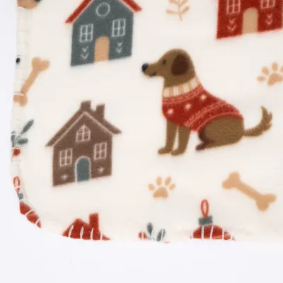 Coperta con motivi di case, ossi, impronte di zampe e cane con maglione rosso. Colore di base bianco, motivi colorati. Coperta con motivi di case, ossi, impronte di zampe e cane con maglione rosso. Colore di base bianco, motivi colorati.