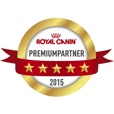 ROYAL CANIN PREMIUMPARTNER 2015, pet zlatnih zvjezdica na crvenoj vrpci unutar zlatnog kruga. Tekst na slici je na njemačkom jeziku.