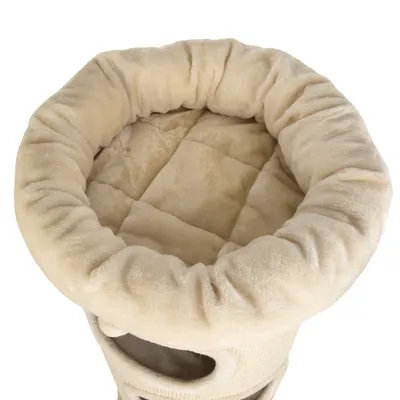 Beiges, rundes Katzenbett mit weicher Polsterung und erhöhtem Rand. Oberansicht des Schlafbereichs.
