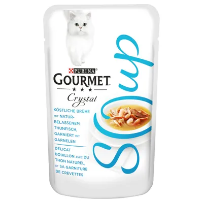 Purina Gourmet Crystal -kissanruoka, annospussi. Teksti: köstliche Brühe mit naturbelassenem Thunfisch, garniert mit Garnelen. Kuvassa valkoinen kissa ja lautasella liemiä ja äyriäisiä.