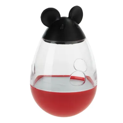 Jouet distributeur en plastique transparent et rouge, couvercle noir avec oreilles de souris, deux ouvertures rondes visibles sur le côté.