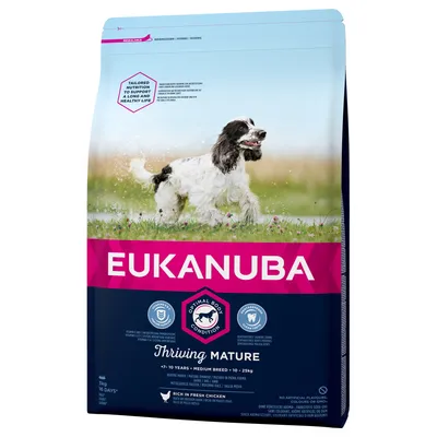 Saco de pienso para perros Eukanuba Thriving Mature, +7–10 años, raza mediana 10–25 kg. Texto visible: Optimal Body Condition, rico en pollo fresco, sin colorantes artificiales.