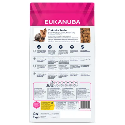 Back of pet food bag showing feeding guide, nutritional information, key benefits such as healthy digestion and strong bones, special kibble shape, and recommended daily amounts by weight.