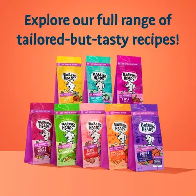 Selection of Barking Heads pet food bags with text: Explore our full range of tailored-but-tasty recipes. Visible varieties include Fat Dog Slim, Tummy Loving Care, Fuss Pot, and others.