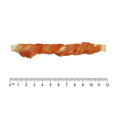 Žvečilni izdelek v obliki palčke, dolžina približno 12 cm, z merilom za prikaz velikosti.