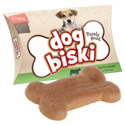 Bone-shaped biscuit in front of packaging showing 'dog biski', 'Purely good.', 'beef & tomato', and net weight 90g.