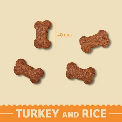 Bone-shaped treats with turkey and rice, each measuring 40 mm in length, shown on a plain background.