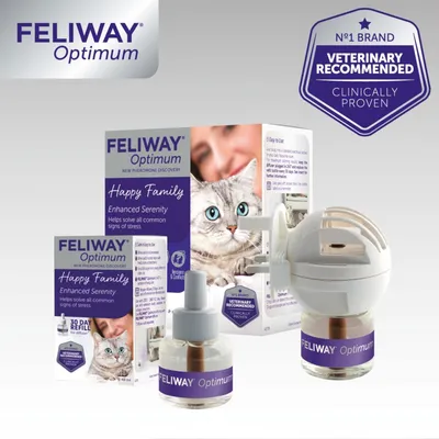 Feliway Optimum diffuser and refill packaging showing 'Happy Family', 'Enhanced Serenity', 'Helps solve all common signs of stress', and 'Veterinary recommended, clinically proven'.