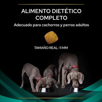Alimento dietético completo, adecuado para cachorros y perros adultos. Tamaño real de la croqueta: 11 mm. Imagen de tres perros grises comiendo en cuencos metálicos.