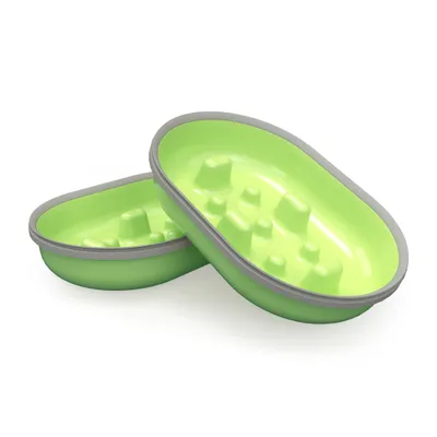 Two green oval plastic bowls with raised bumps inside and grey rims, stacked together. No visible brand or text.