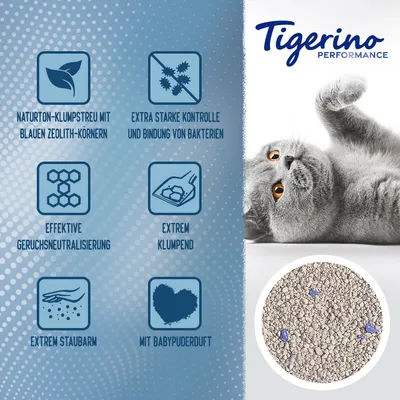 Tigerino Performance. Texte en allemand : litière agglomérante naturelle avec grains de zéolithe bleus, contrôle des bactéries, neutralisation des odeurs, peu poussiéreuse, parfum talc bébé.