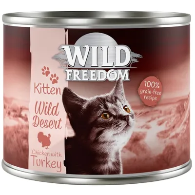 Lata de comida para gatitos Wild Freedom Kitten Wild Desert, Chicken with Turkey. Texto visible: 100% grain-free recipe.