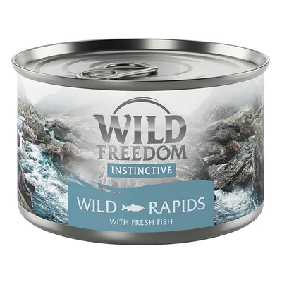 Boîte de nourriture avec texte : Wild Freedom Instinctive, Wild Rapids with fresh fish. Illustration de rivière et rochers sur l’étiquette.