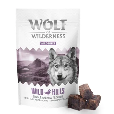 Wolf of Wilderness Wild Bites Wild Hills, single animal protein, fresh duck meat & offal, 100% grain-free recipe. Sachet debout avec morceaux visibles devant l’emballage.