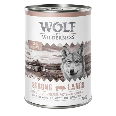 Wolf of Wilderness Strong Lands, 100% grain-free, porc avec baies sauvages, racines et herbes sauvages, boîte de 400 g. Texte en anglais et allemand visible sur l’étiquette.