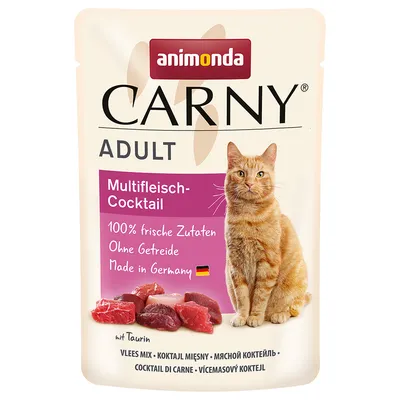 Animonda Carny Adult Multifleisch-Cocktail, 100% ingredientes frescos, sin cereales, Made in Germany, con taurina. El envase muestra un gato rojo y trozos de carne.