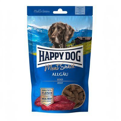 Verpakking Happy Dog Meat Snack Allgäu, rund. Tekst: 'Qualitäts-Fleisch aus Deutschland', 'Real Beef Made in Germany'. Afbeelding van hond, stukjes vlees en snacks zichtbaar.